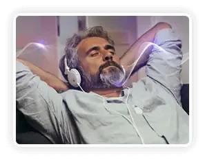 Man relaxing with headphones, eyes closed